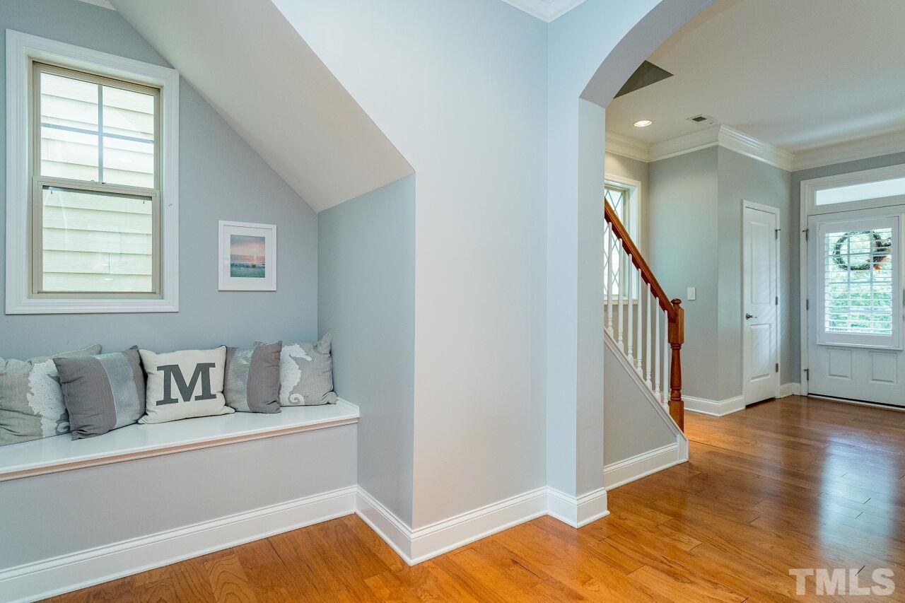 1517 Fullerton Place Raleigh, NC 27607 - Photo 4 of 30 Light filled foyer with beautiful hardwoods, paint colors and built in bench greet you in this cheery home.