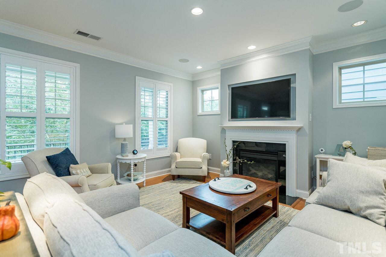 1517 Fullerton Place Raleigh, NC 27607 - Photo 6 of 30 Shutters, hardwoods, recessed lighting, surround sound speakers & fireplace make this living room easy to entertain!