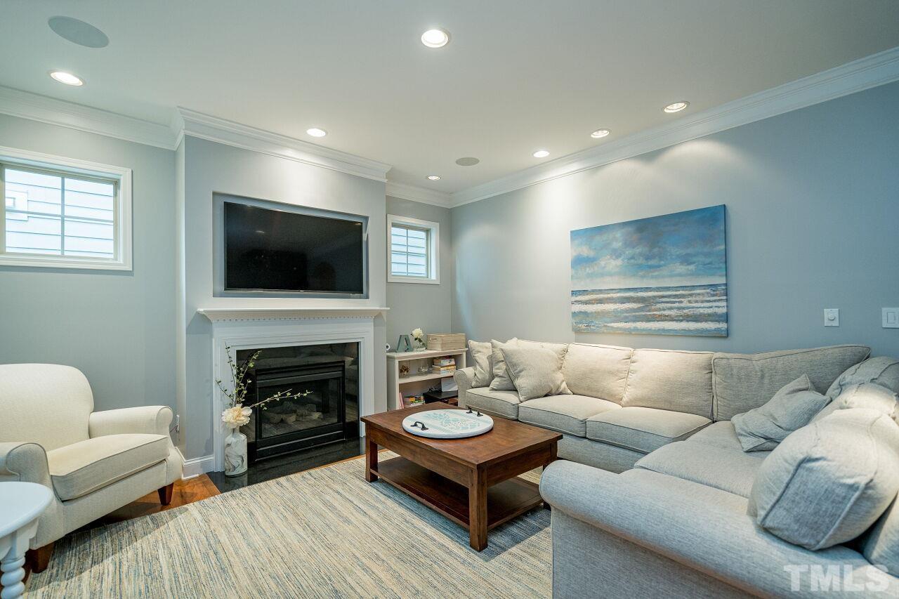 1517 Fullerton Place Raleigh, NC 27607 - Photo 8 of 30 Shutters, hardwoods, recessed lighting, surround sound speakers & fireplace make this living room easy to entertain!