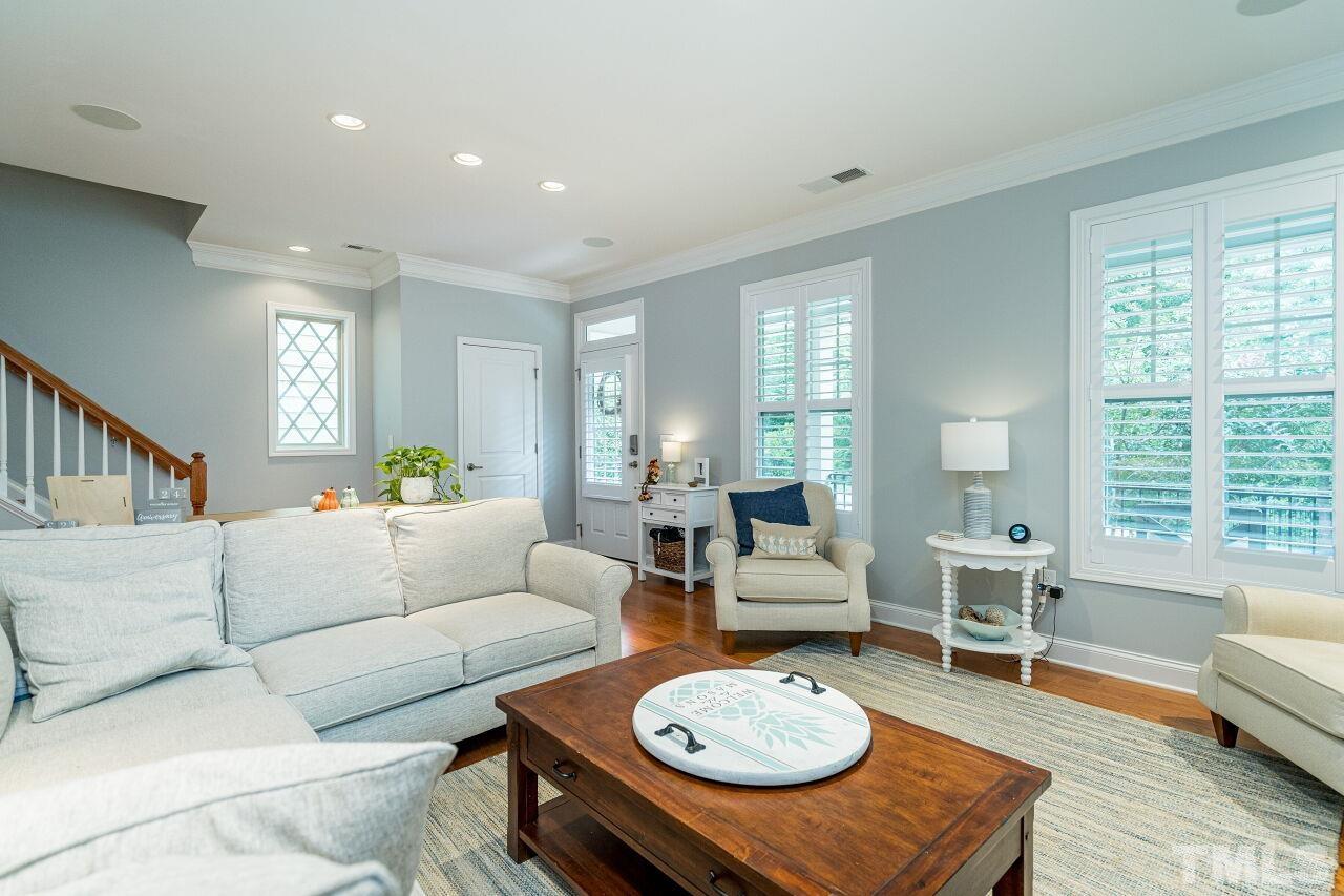 1517 Fullerton Place Raleigh, NC 27607 - Photo 9 of 30 Shutters, hardwoods, recessed lighting, surround sound speakers & fireplace make this living room easy to entertain!