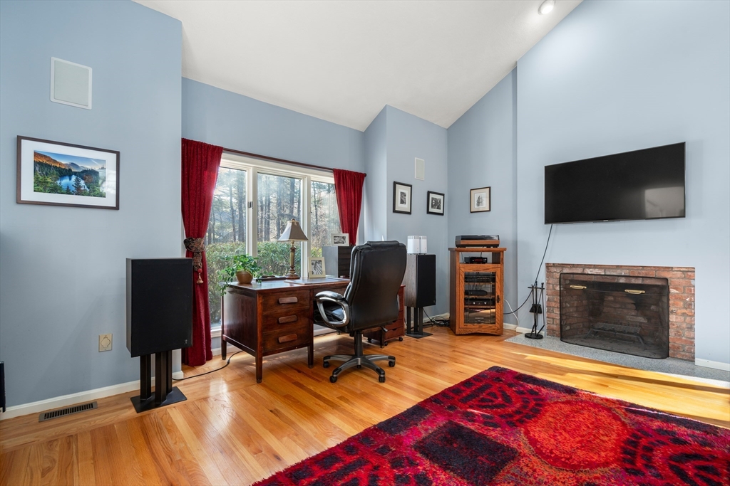 18 Fox Run Road Sudbury, MA 01776 - Photo 15 of 41 a living room with fireplace furniture and a flat screen tv