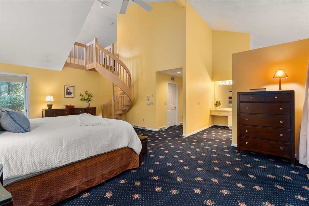 18 Fox Run Road Sudbury, MA 01776 - Photo 17 of 41 a bedroom with a bed and a lamp