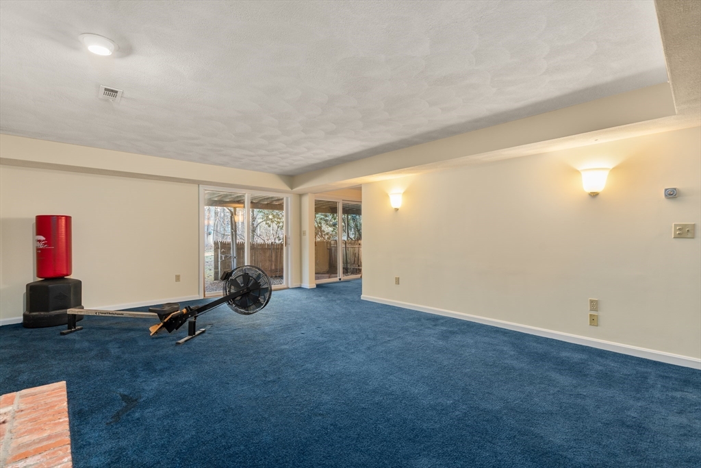 18 Fox Run Road Sudbury, MA 01776 - Photo 29 of 41 a view of a room with gym equipment and windows