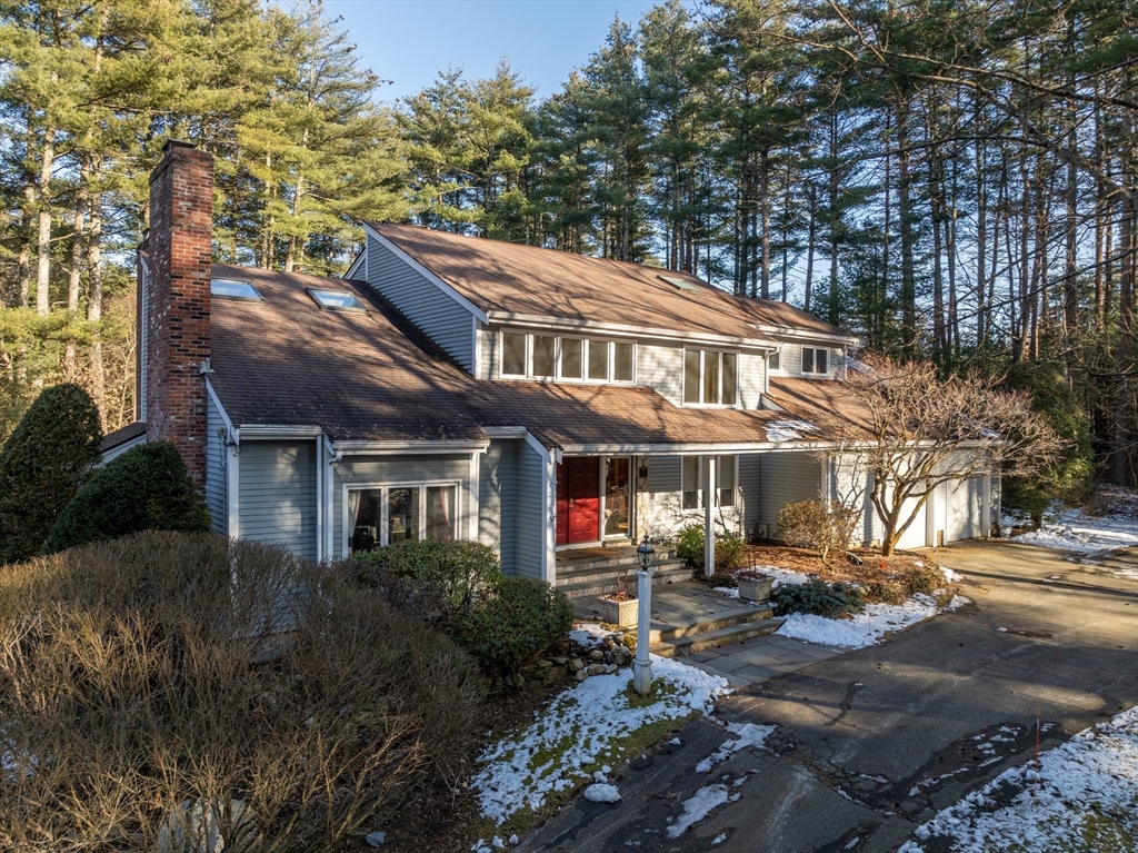 18 Fox Run Road Sudbury, MA 01776 - Photo 3 of 41 a backyard of a house with yard and outdoor seating