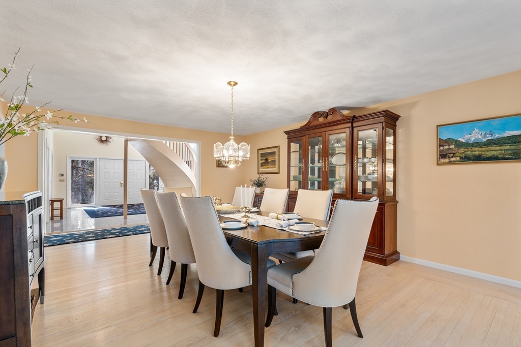 18 Fox Run Road Sudbury, MA 01776 - Photo 8 of 41 a view of a dining room with furniture and chandelier