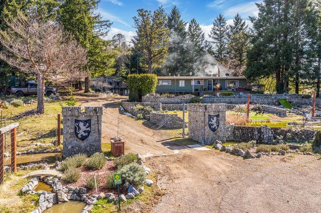 16460 Soda Springs Road Los Gatos, CA 95033 - Photo 1 of 43 a view of a swimming pool with sitting area and trees around