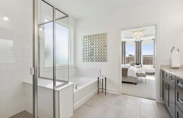 a bathroom with a tub shower and sink