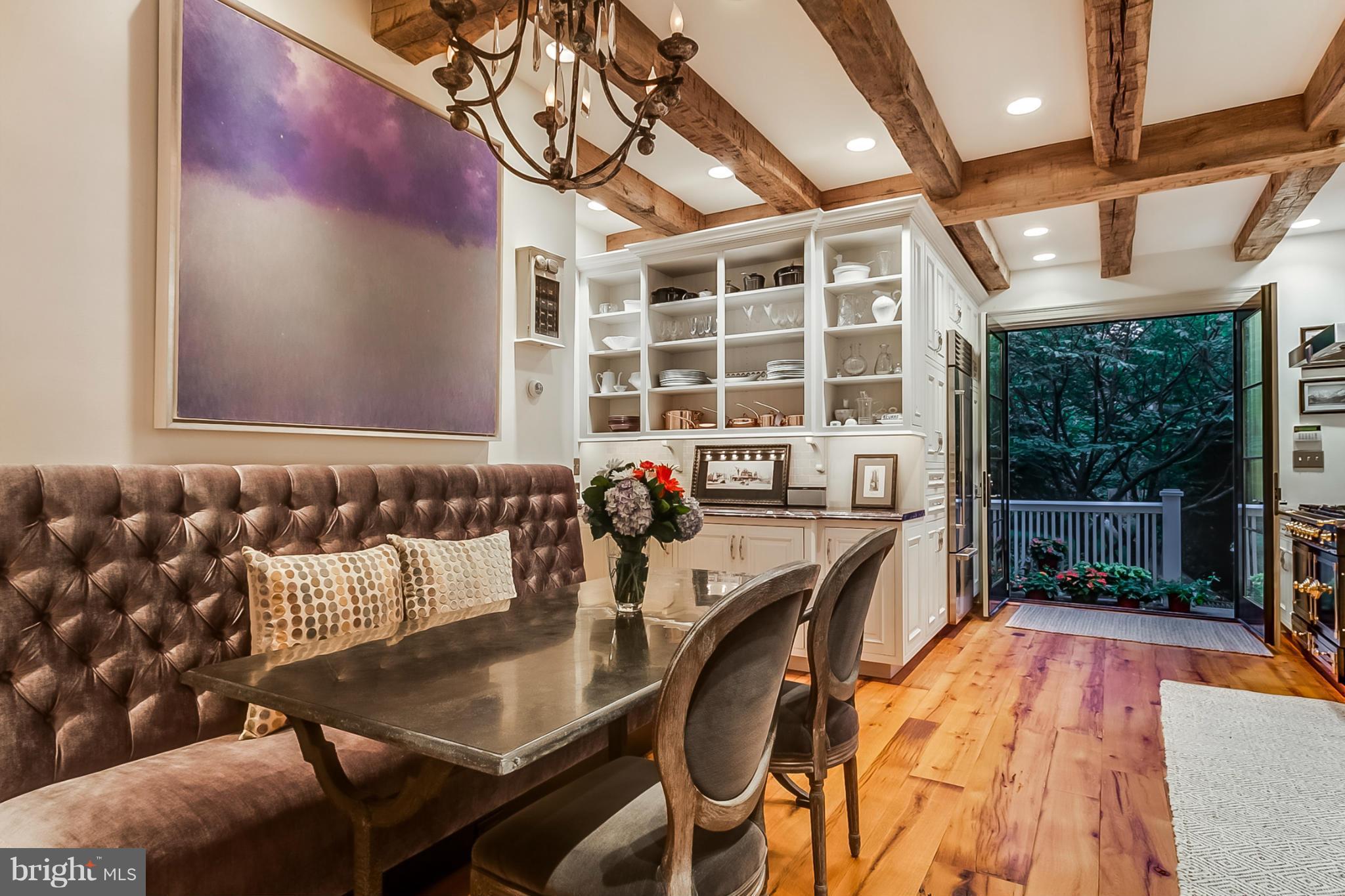 302 Club Road Baltimore, MD 21210 - Photo 1 of 28 a view of a dining room with furniture a chandelier and wooden floor