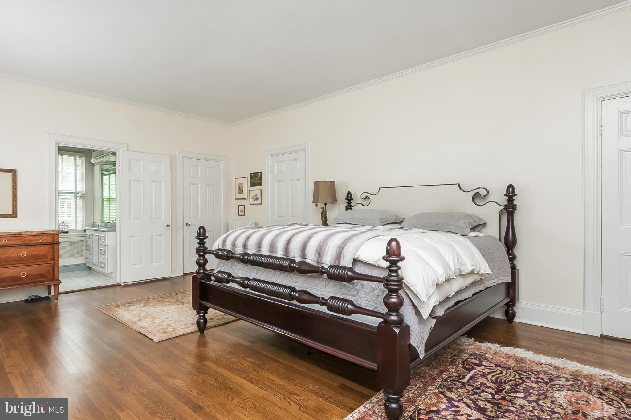 302 Club Road Baltimore, MD 21210 - Photo 13 of 28 a bedroom with a bed and wooden floor