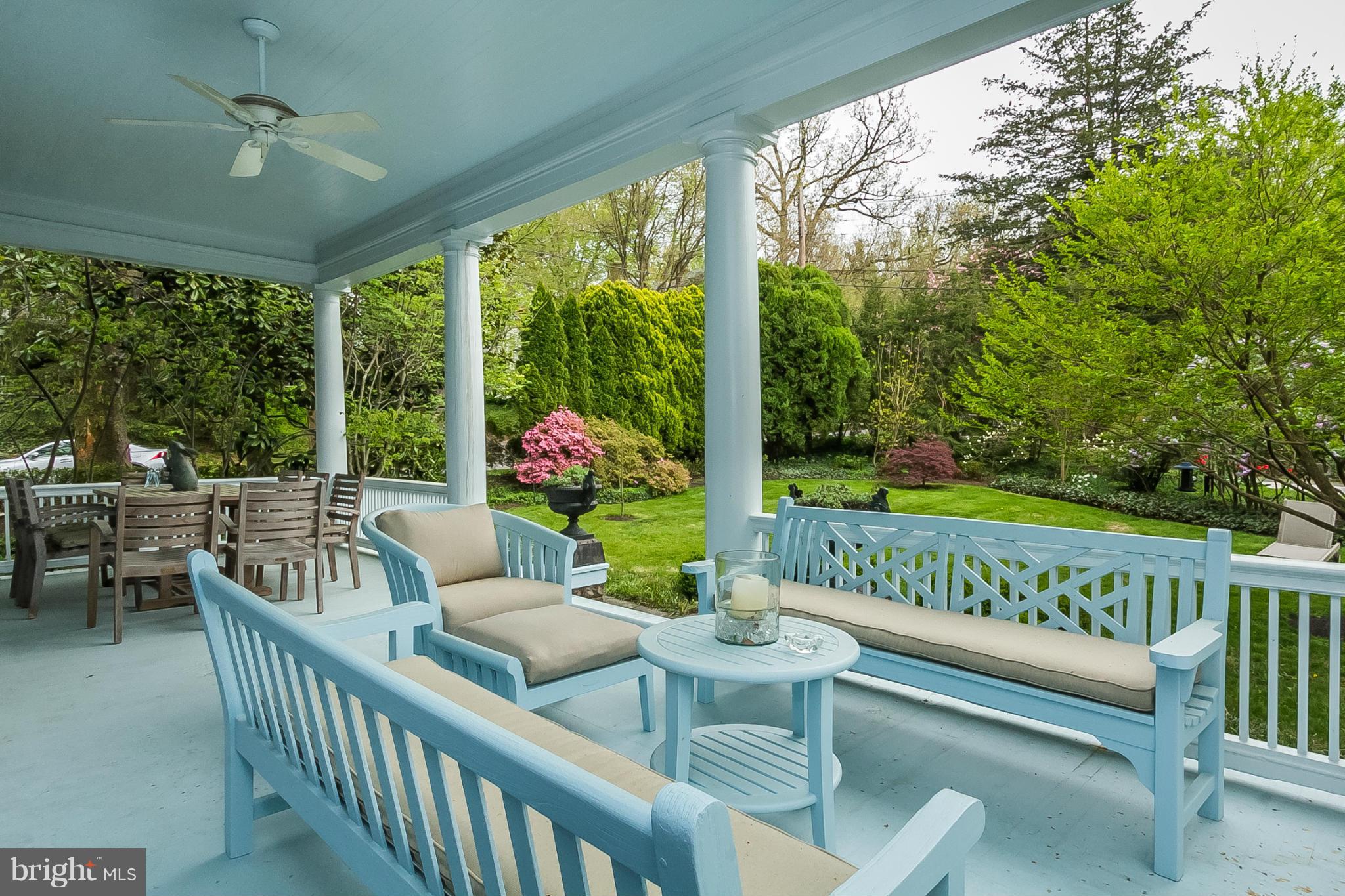 302 Club Road Baltimore, MD 21210 - Photo 21 of 28 a view of a patio with a table chairs and a floor to ceiling window