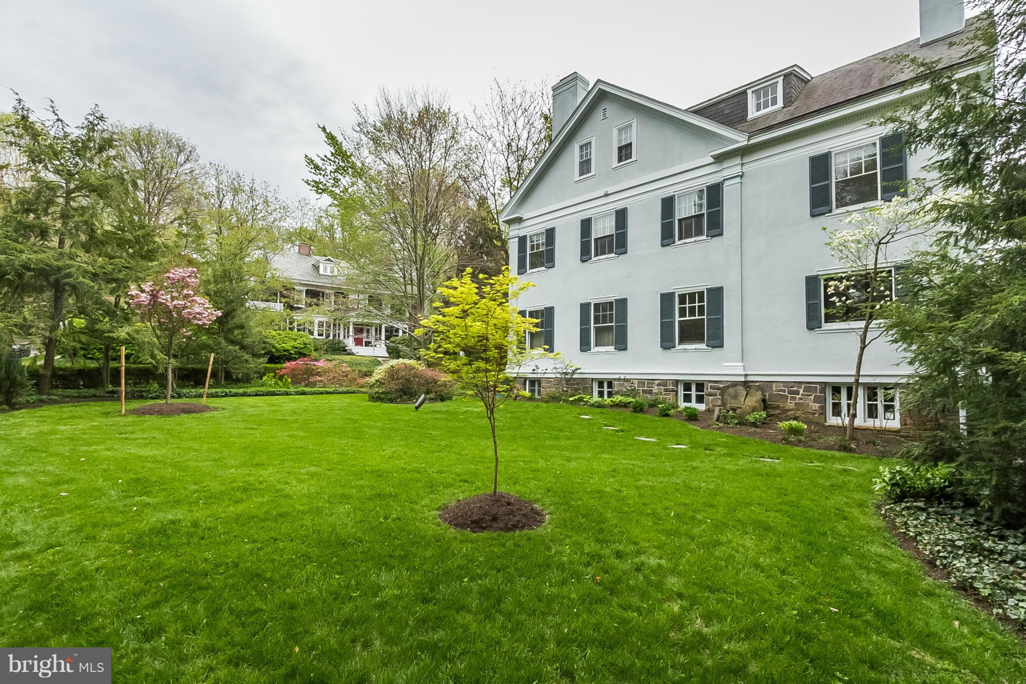 302 Club Road Baltimore, MD 21210 - Photo 26 of 28 a front view of a house with a yard and trees