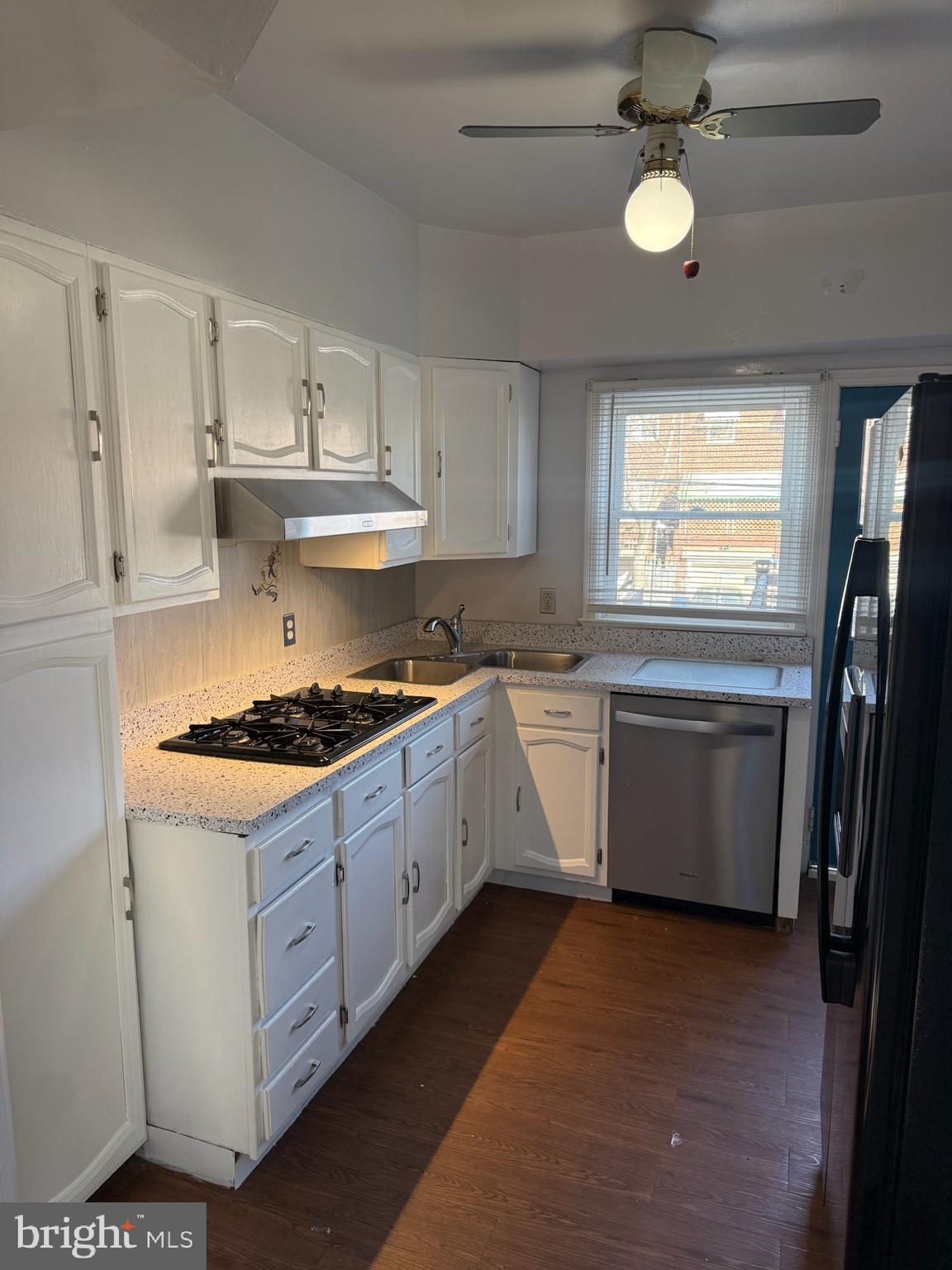 49 Briarwood Road Baltimore, MD 21228 - Photo 2 of 9 a kitchen with a stove oven and sink