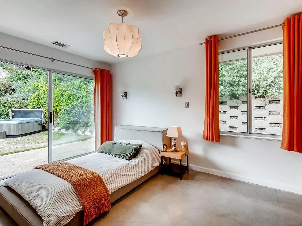 6428 Shirehall Drive San Diego, CA 92111 - Photo 11 of 15 a bedroom with a bed and large window