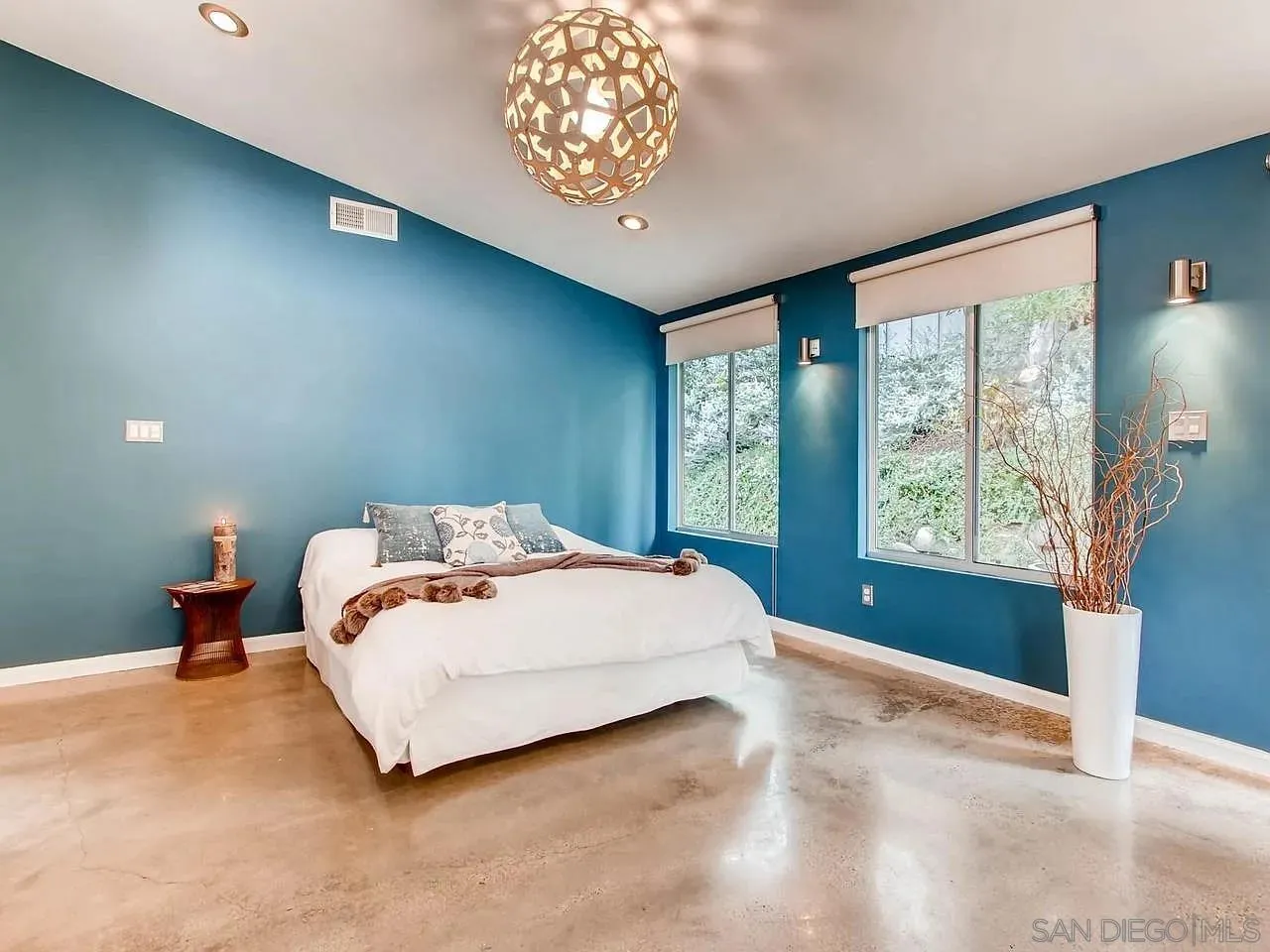 6428 Shirehall Drive San Diego, CA 92111 - Photo 8 of 15 a bedroom with a bed and a large window