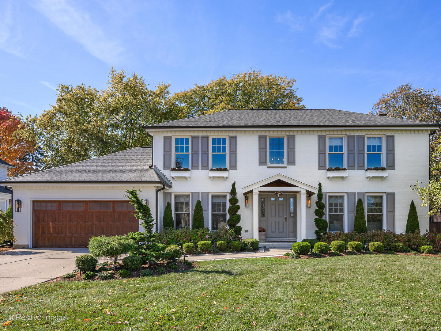 front view of a house with a yard