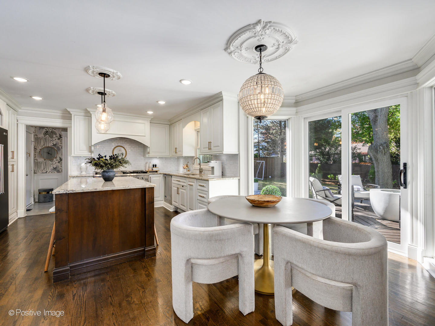 1026 Elmdale Road Glenview, IL 60025 - Photo 12 of 38 a kitchen with a table chairs and microwave
