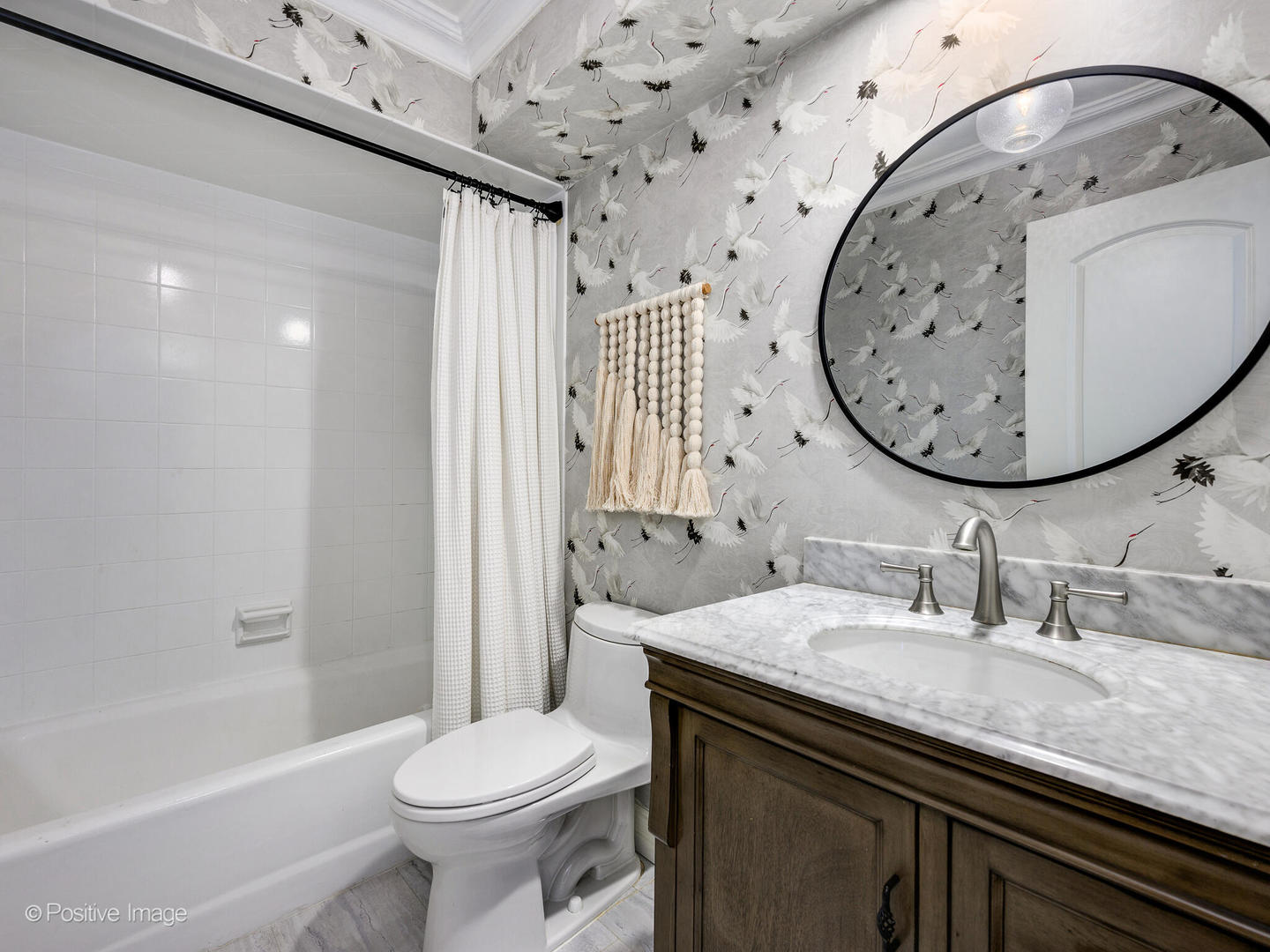 1026 Elmdale Road Glenview, IL 60025 - Photo 24 of 38 a bathroom with a sink a toilet and a mirror