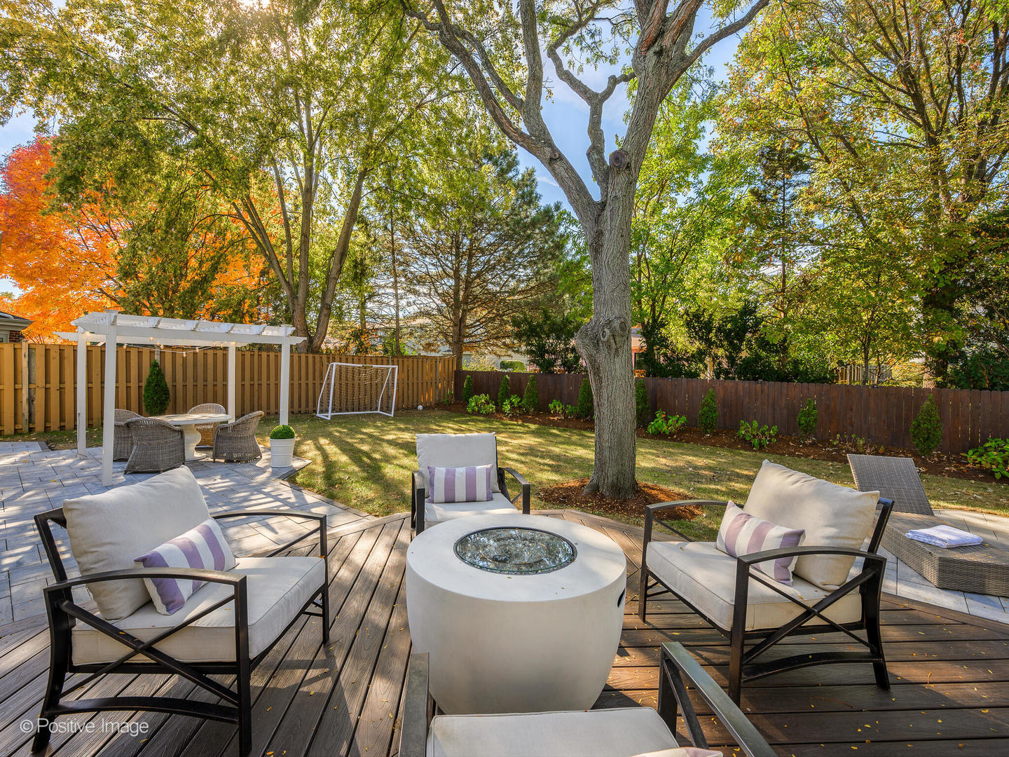 1026 Elmdale Road Glenview, IL 60025 - Photo 32 of 38 a view of a patio with couches chairs and a table and chairs with wooden fence