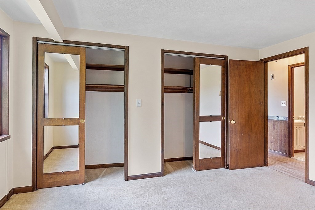 61 Spencer Road, Unit 30I Boxborough, MA 01719 - Photo 16 of 28 an empty room with windows and closet