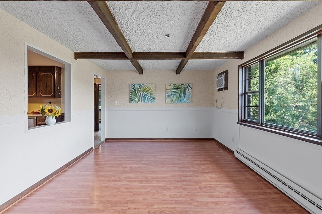 61 Spencer Road, Unit 30I Boxborough, MA 01719 - Photo 4 of 28 wooden floor in an empty room with a window