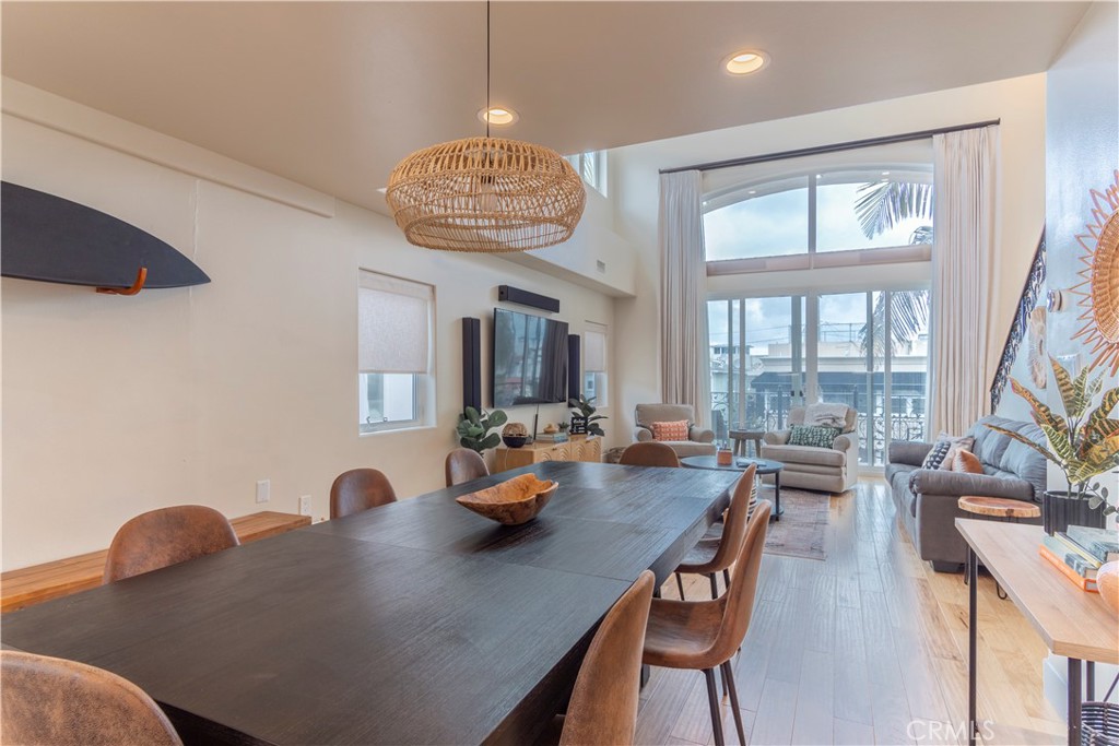 62 62nd Place Long Beach, CA 90803 - Photo 14 of 55 a view of a dining room with furniture wooden floor and chandelier