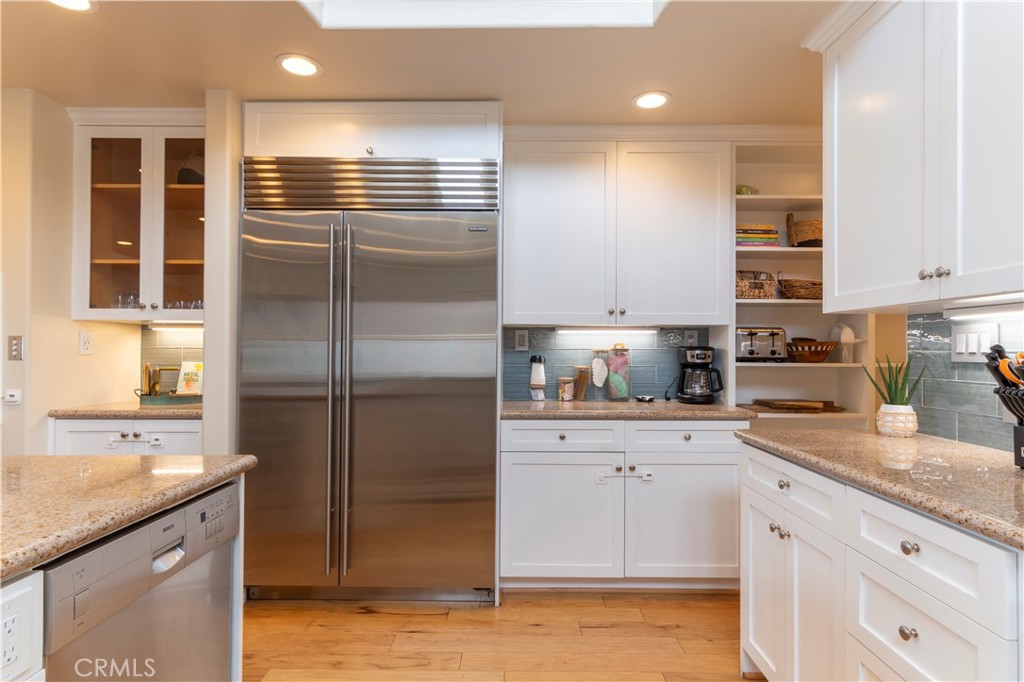 62 62nd Place Long Beach, CA 90803 - Photo 18 of 55 a kitchen with stainless steel appliances granite countertop a refrigerator and a sink