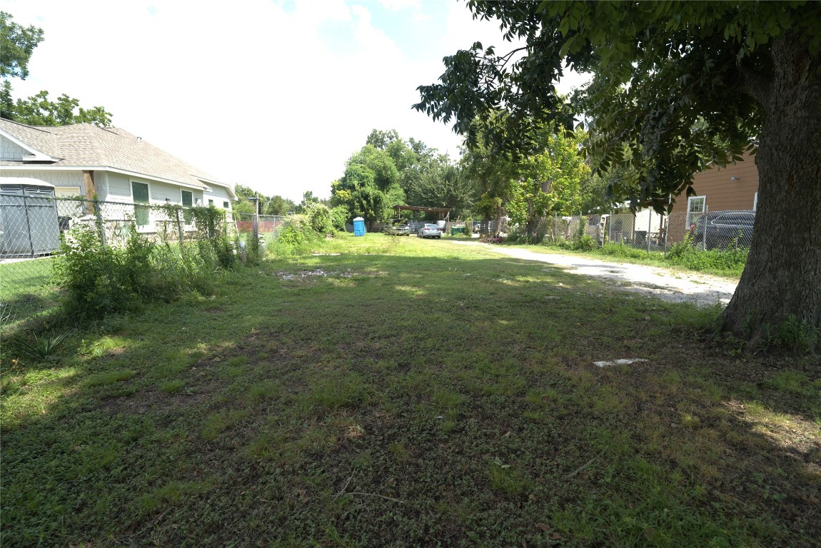 0 Pickering Street Houston, TX 77091 - Photo 2 of 12 a view of yard with green space and trees in the background
