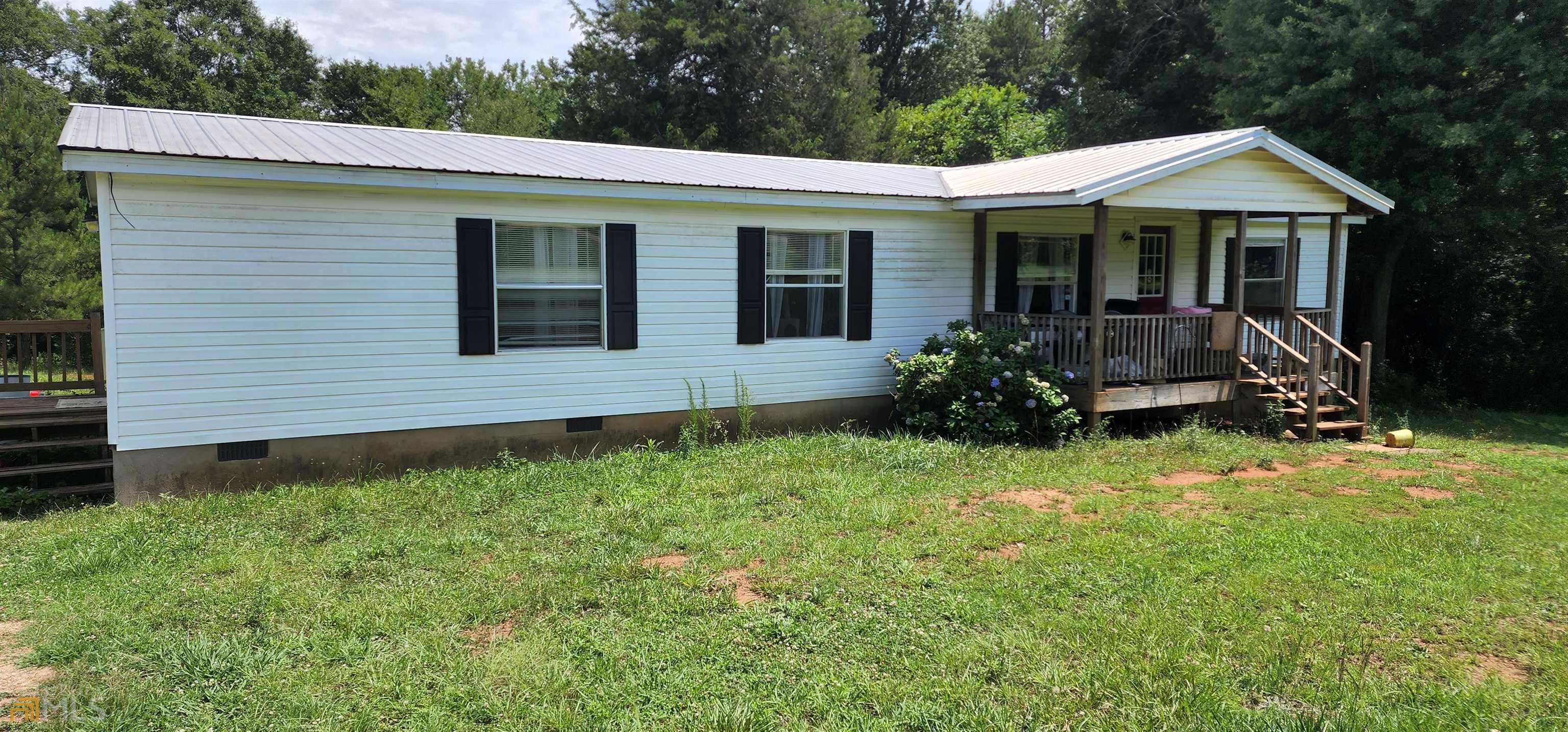 258 Hebron Road Commerce, GA 30530 - Photo 1 of 1 a view of a house with a yard and plants