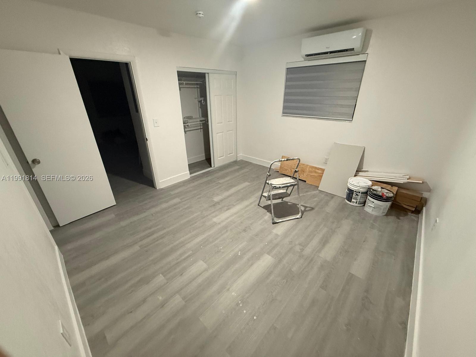 225 Southwest 76th Court, Unit 225 Miami, FL 33144 - Photo 3 of 7 a living room with furniture and a wooden floor