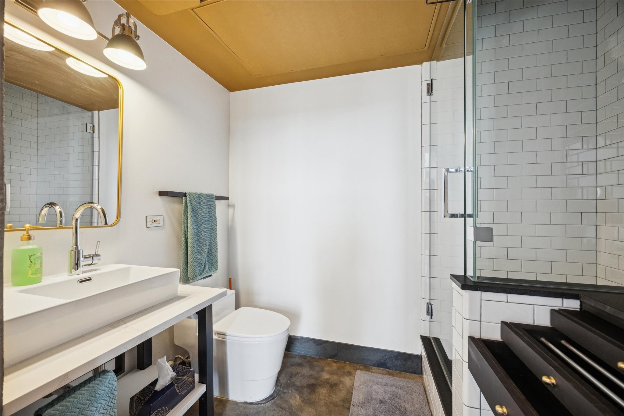 2000 Bagby Street, Unit 5400 Houston, TX 77002 - Photo 13 of 47 First level bathroom and utility, Bespoke vanity and all new fixtures, tile, ventilation, and hardware.