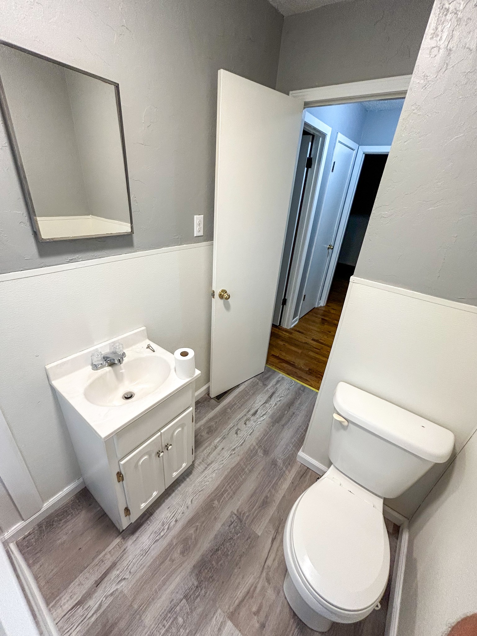 181 Jones Street Huntingdon, TN 38344 - Photo 19 of 21 a white toilet sitting next to a bathroom sink