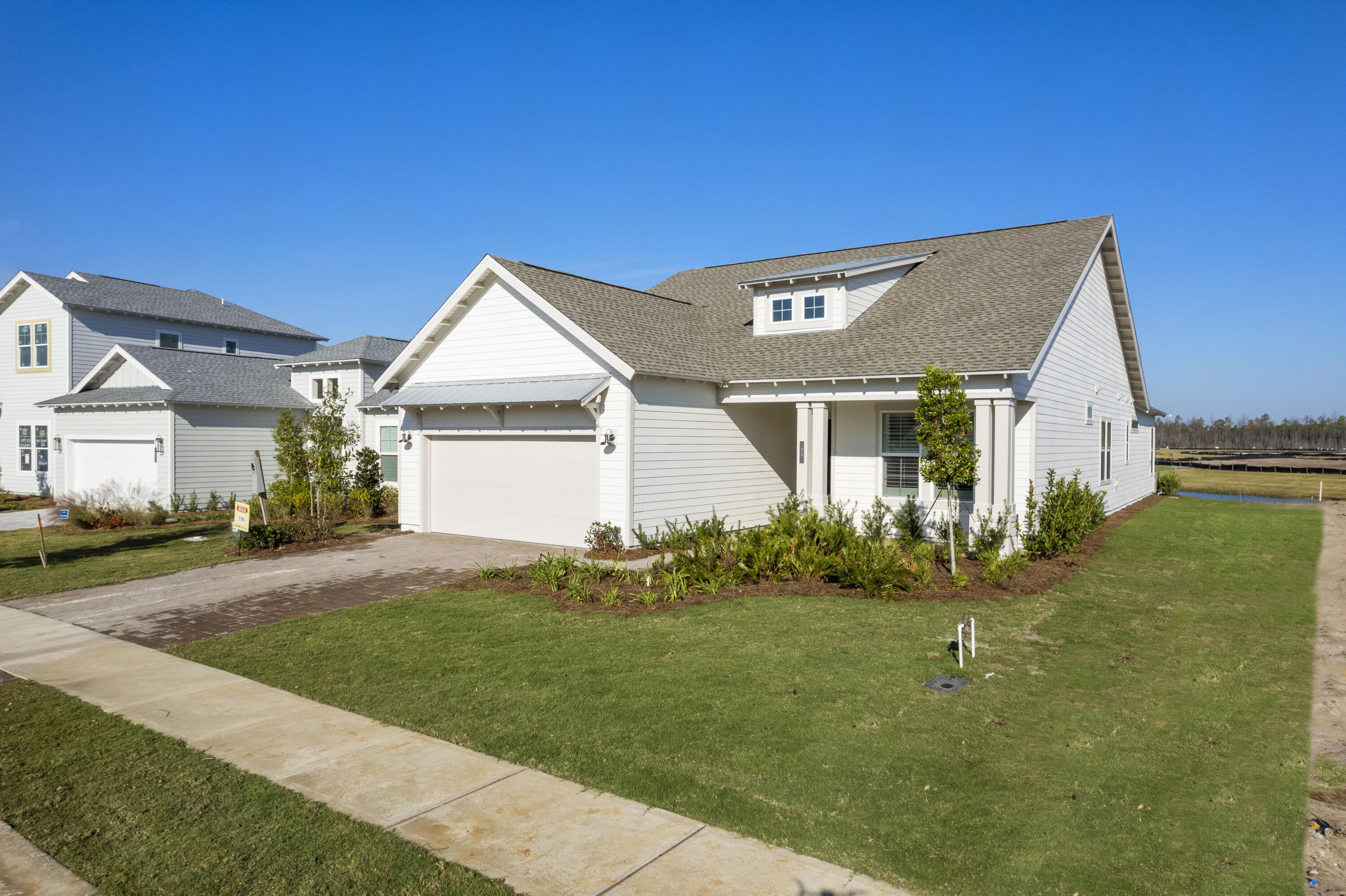 95 Ravine Rd Inlet Beach Inlet Beach, FL 32461 - Photo 15 of 42 a front view of a house with a garden