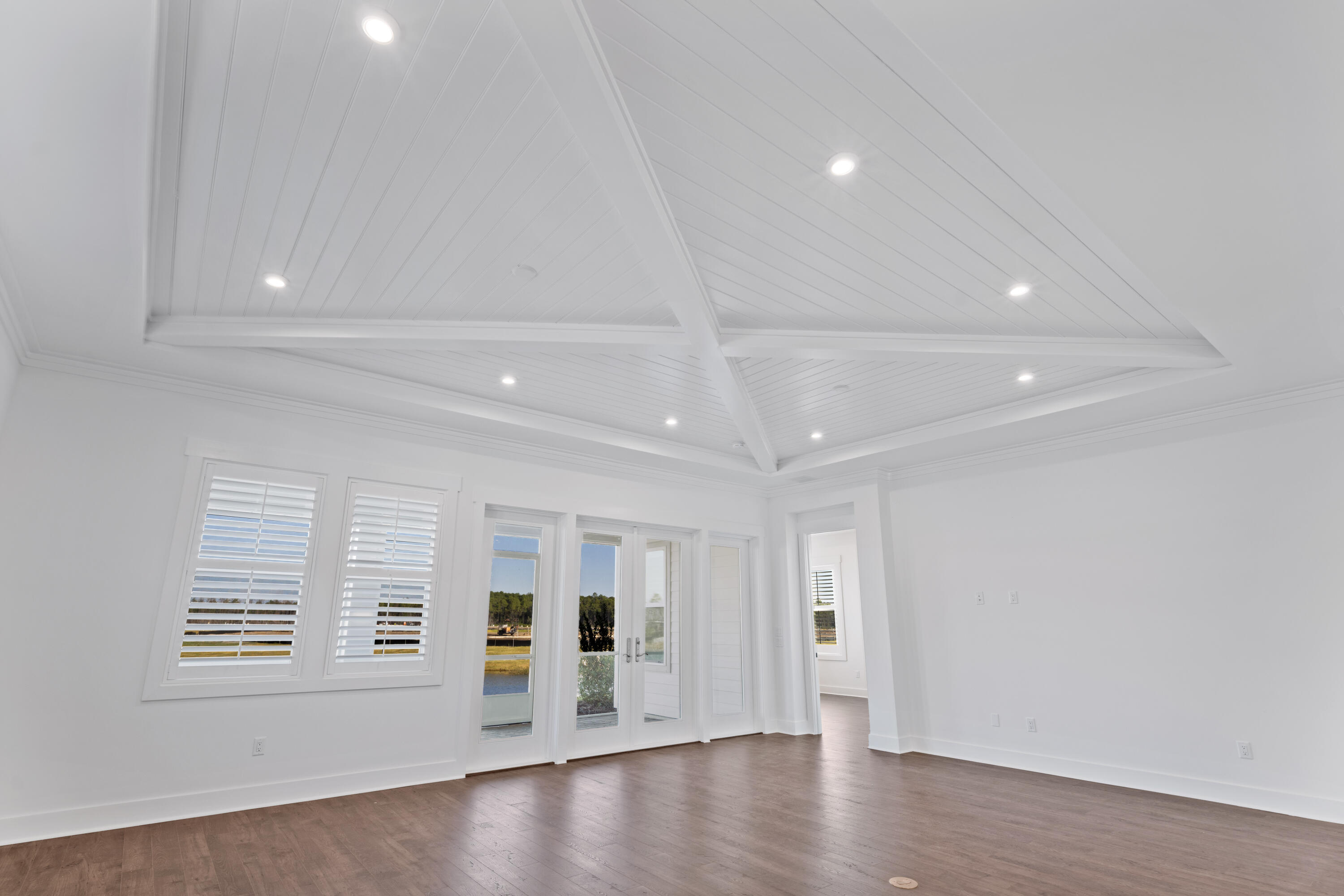 95 Ravine Rd Inlet Beach Inlet Beach, FL 32461 - Photo 19 of 42 a view of an empty room with a window and wooden floor