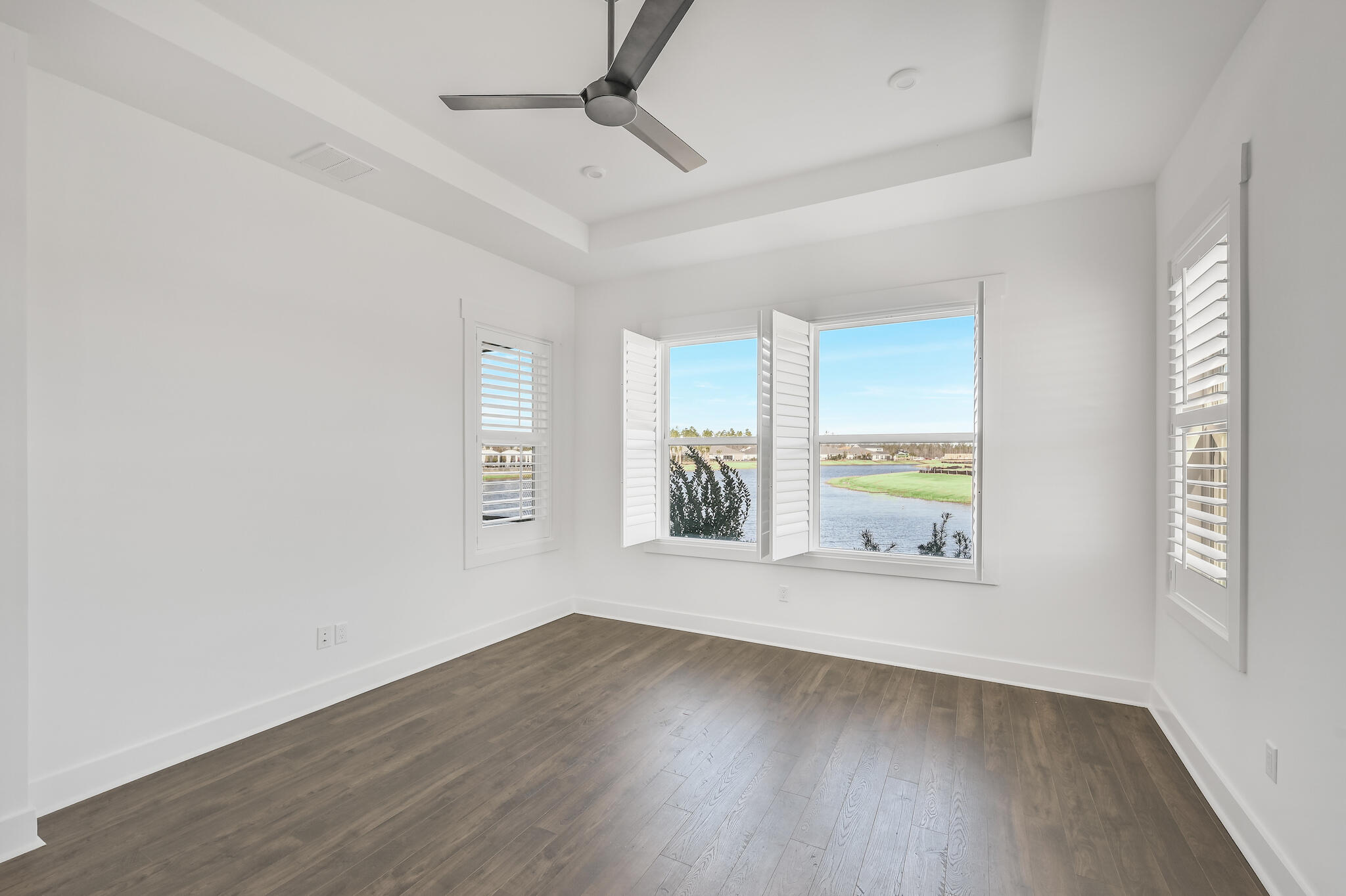95 Ravine Rd Inlet Beach Inlet Beach, FL 32461 - Photo 25 of 42 an empty room with wooden floor and windows