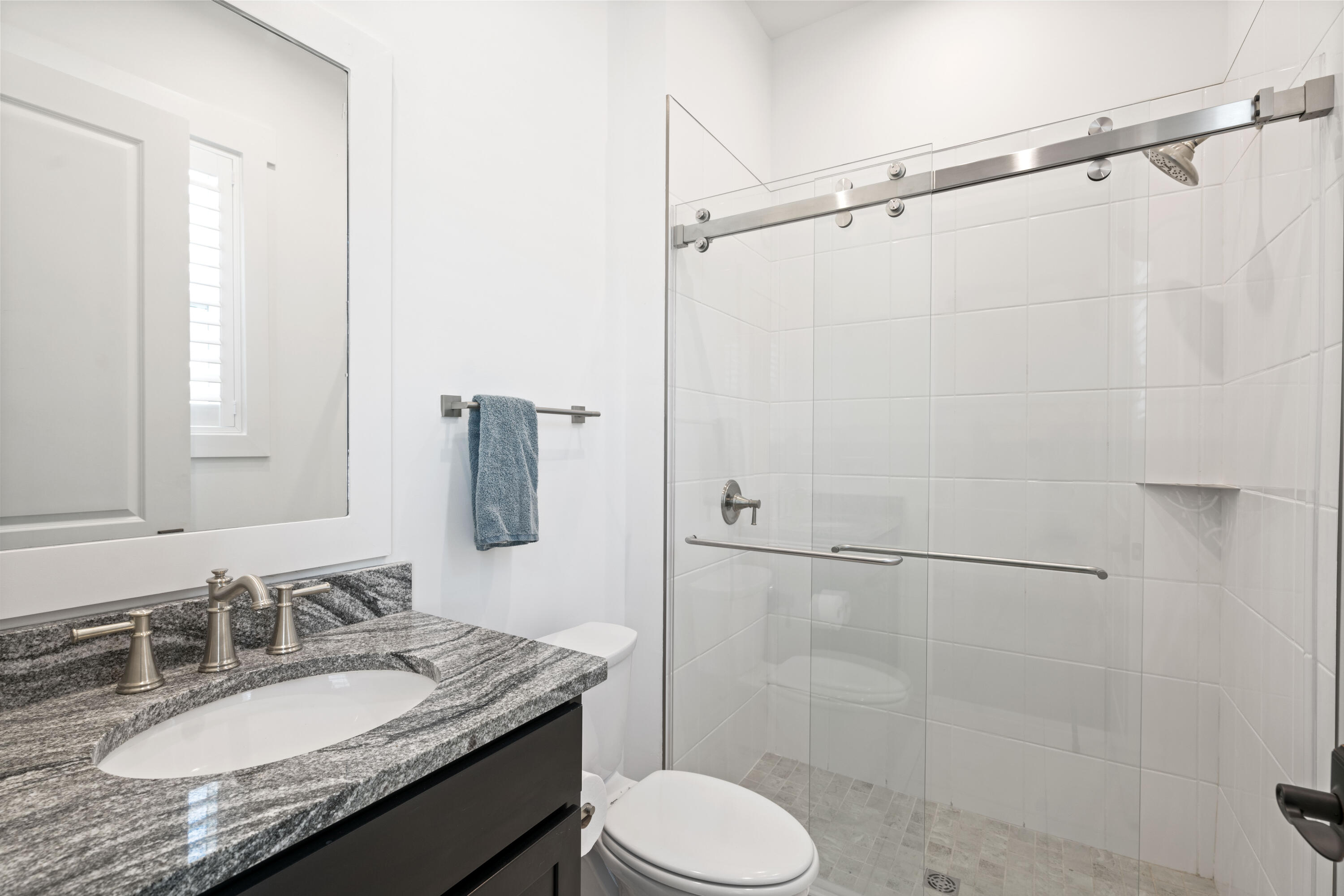 95 Ravine Rd Inlet Beach Inlet Beach, FL 32461 - Photo 32 of 42 a bathroom with a granite countertop sink toilet and shower