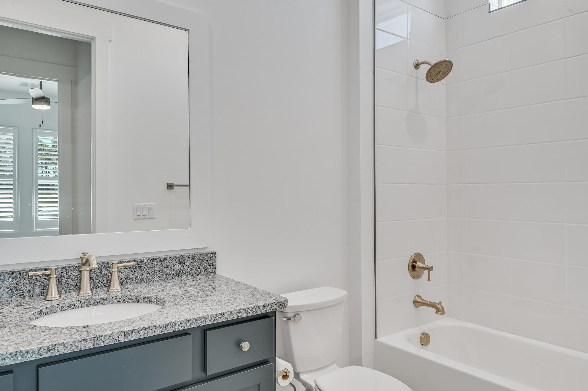 95 Ravine Rd Inlet Beach Inlet Beach, FL 32461 - Photo 34 of 42 a bathroom with a granite countertop sink a toilet and bathtub