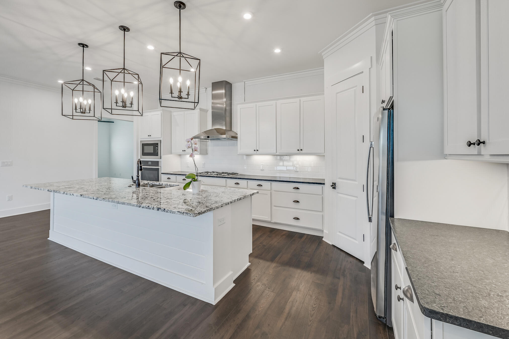 95 Ravine Rd Inlet Beach Inlet Beach, FL 32461 - Photo 6 of 42 a kitchen with stainless steel appliances granite countertop a sink a stove and a wooden floors