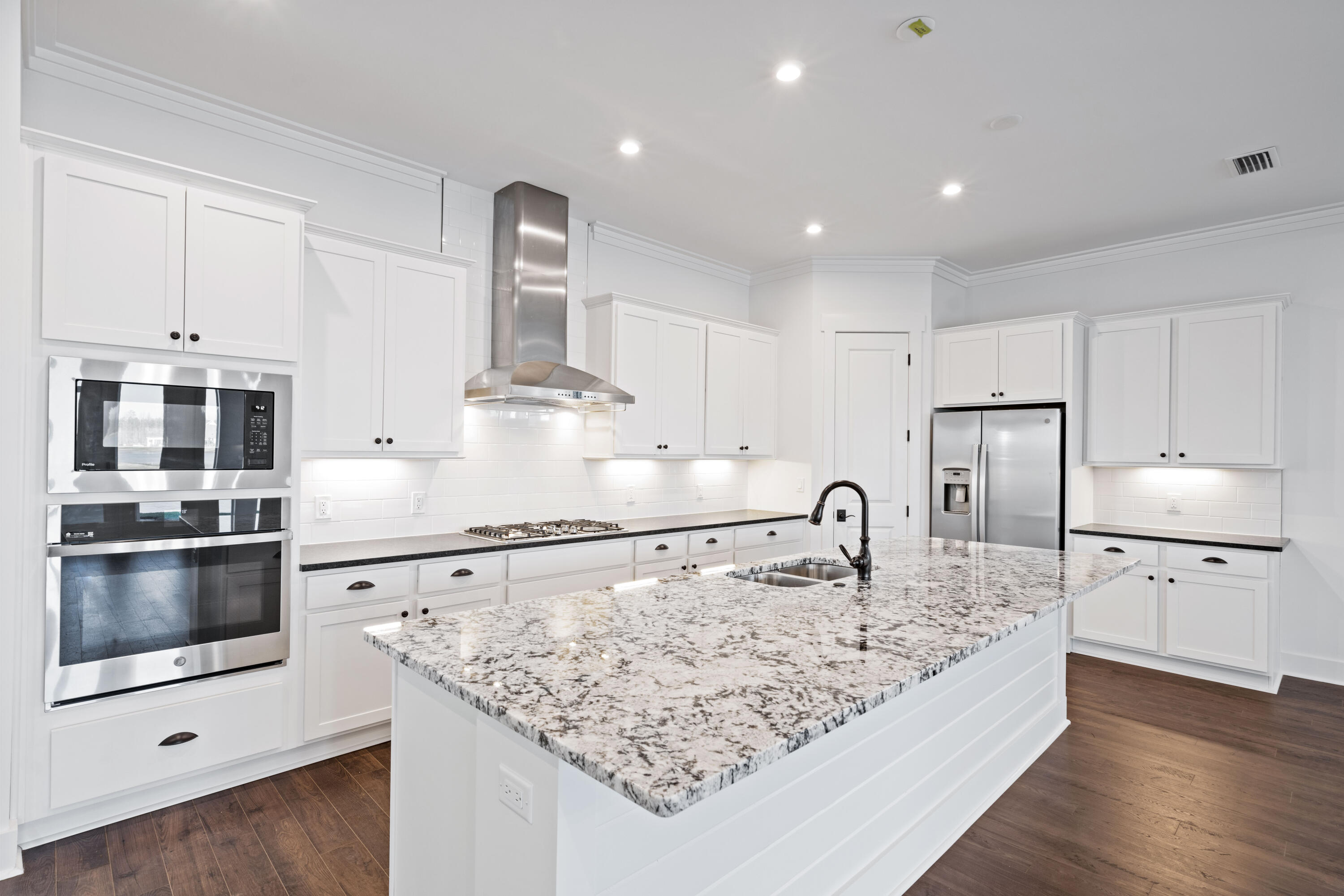95 Ravine Rd Inlet Beach Inlet Beach, FL 32461 - Photo 7 of 42 a kitchen with stainless steel appliances granite countertop a sink refrigerator and microwave
