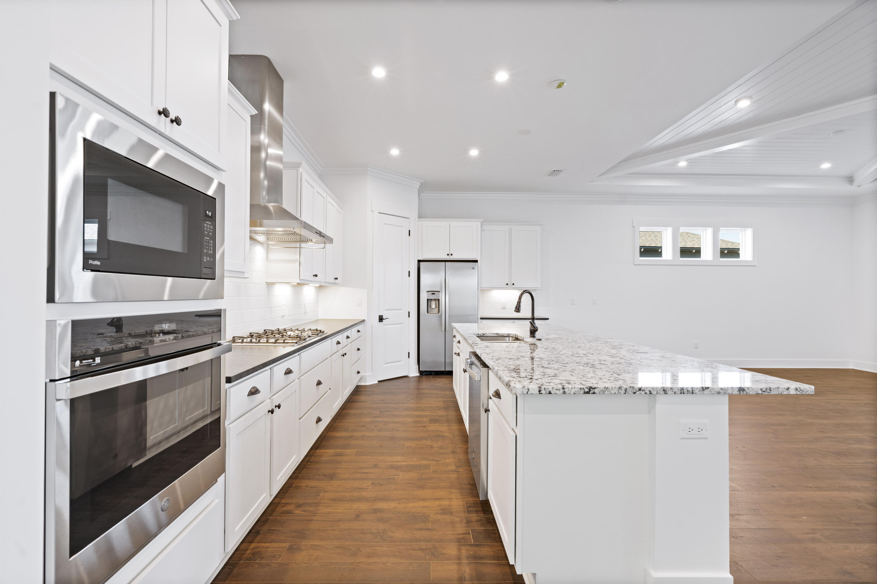 95 Ravine Rd Inlet Beach Inlet Beach, FL 32461 - Photo 9 of 42 a large kitchen with stainless steel appliances granite countertop a lot of counter space and wooden floor