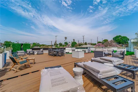 a view of a garden with a building in the background