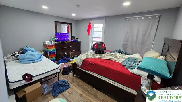 a bedroom with a bed and a table