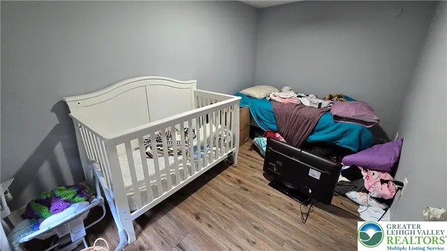 a white toilet sitting next to a small bathroom sink