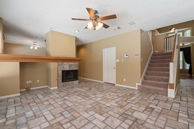 a view of an empty room with a fireplace