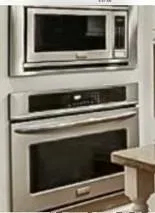 a stove top oven sitting inside of a kitchen
