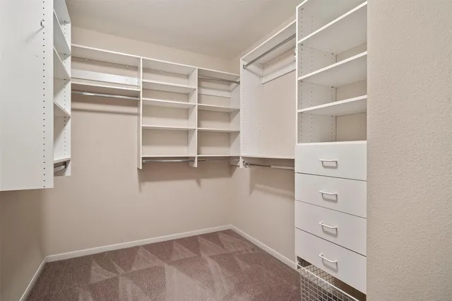a view of an empty walk in closet