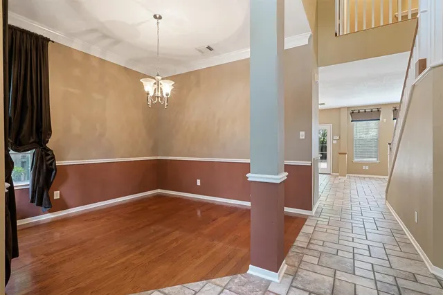 a view of a hallway with a chandelier