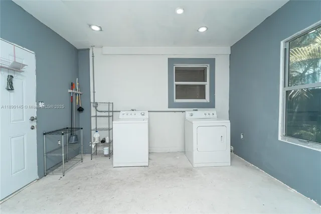 wooden floor with cabinets and window