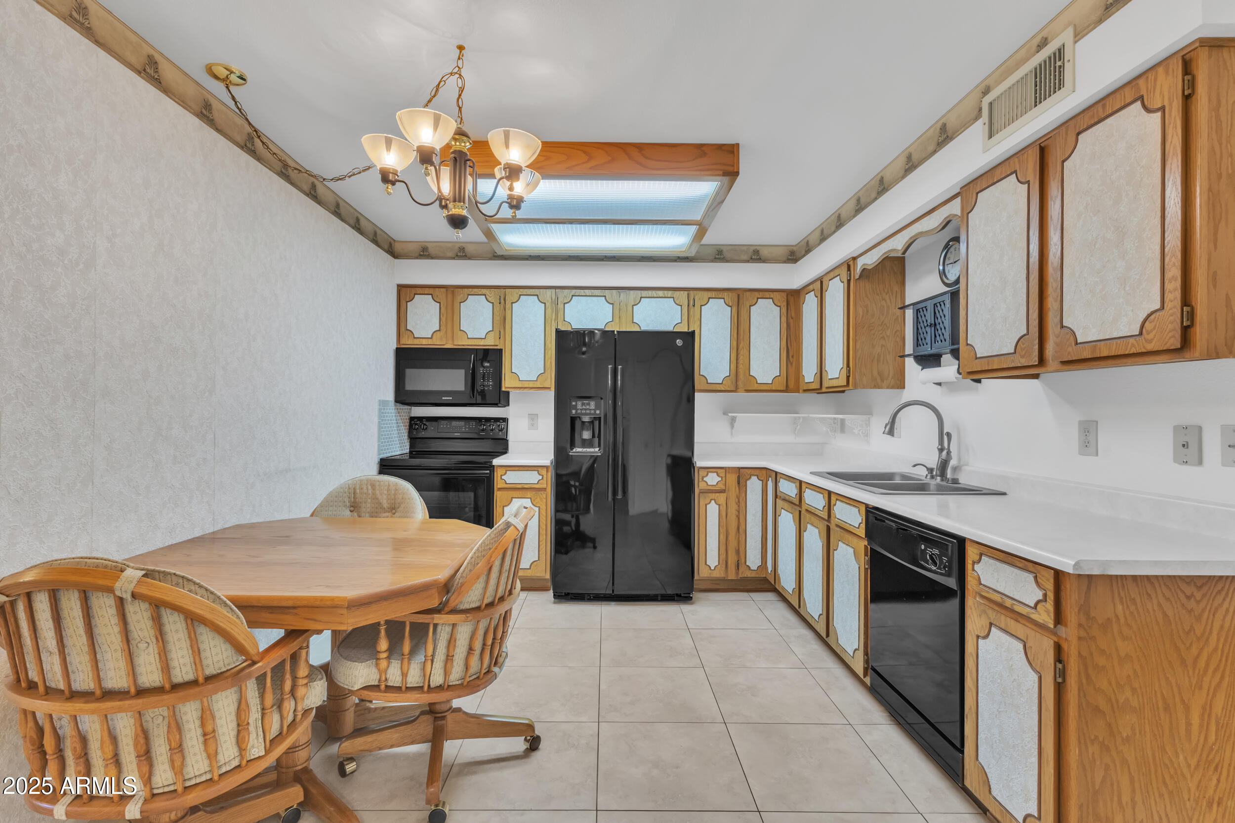 520 South Greenfield Road, Unit 13 Mesa, AZ 85206 - Photo 9 of 44 a kitchen with stainless steel appliances granite countertop a sink and cabinets
