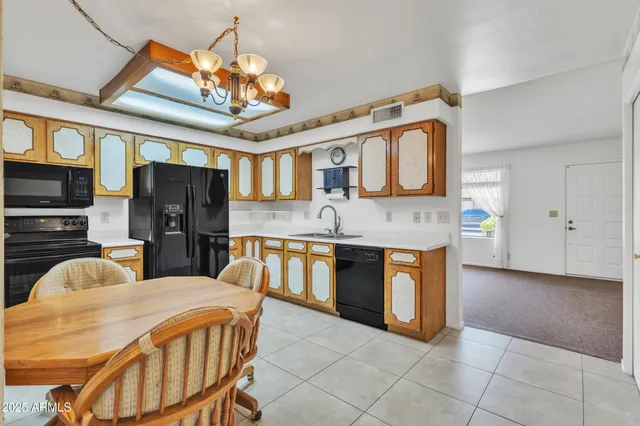 a kitchen with stainless steel appliances granite countertop a sink and cabinets