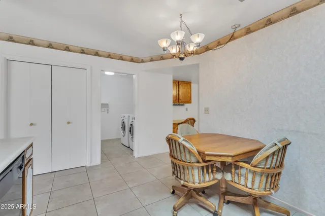 a view of a livingroom with chairs